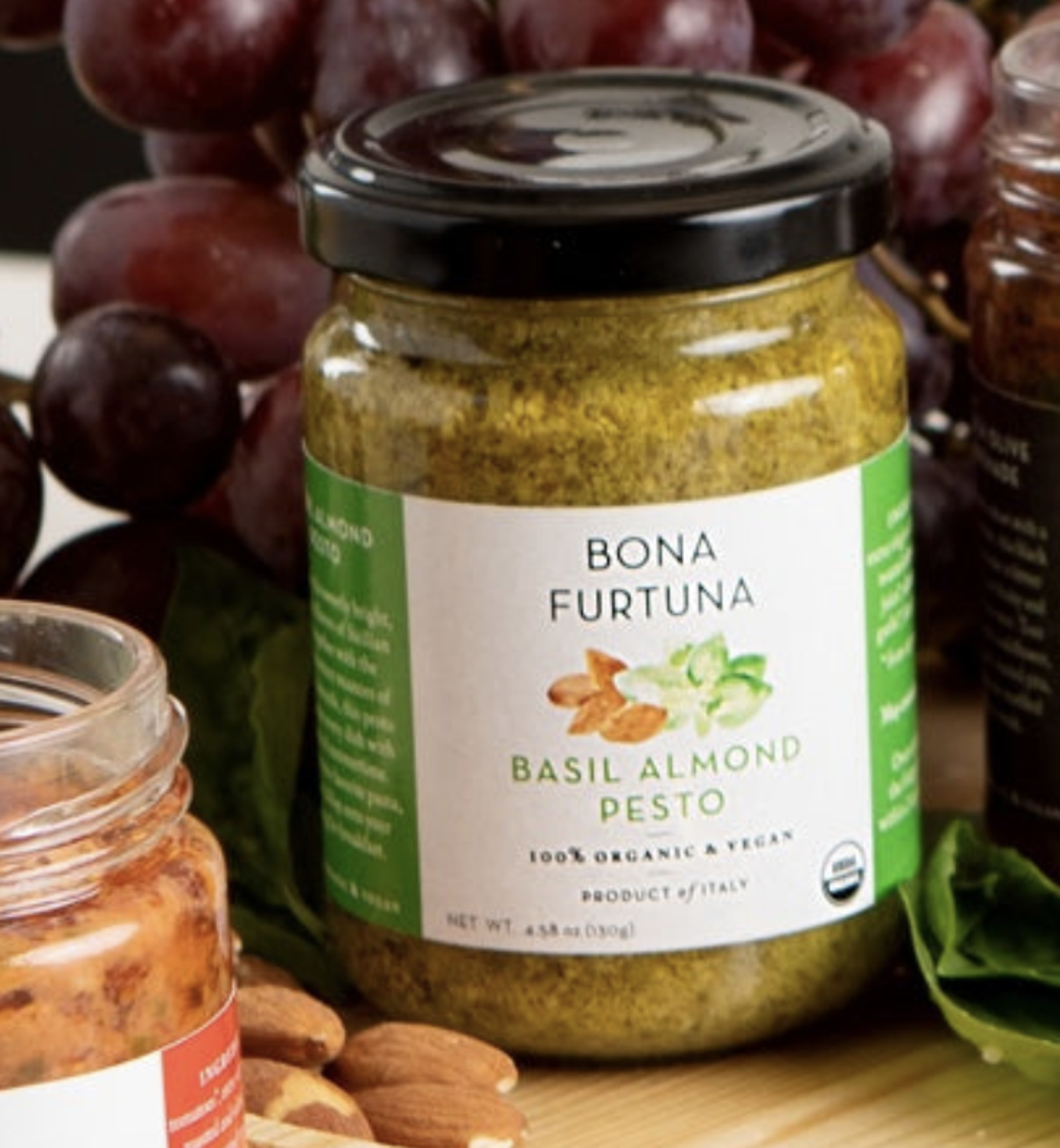 Bona Furtuna Basil Almond Pesto  styled with grapes and almonds