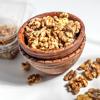 Raw Walnuts in a bowl and a good source of vitamins and protein