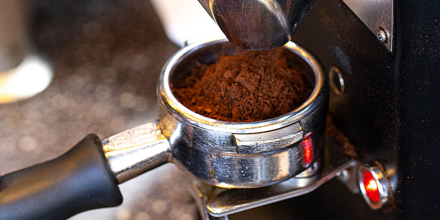 Coffee being ground at DLM Coffee Bar