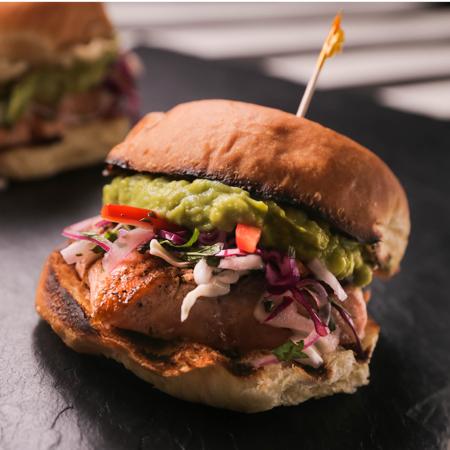 Grilled Salmon Sandwich With Crunchy Cabbage Slaw and Guacamole