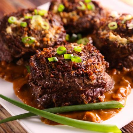 Bacon Flank Steak Pinwheel With Andouille Sauce