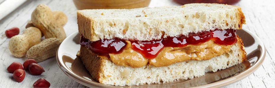 Peanut butter and jelly sandwich on crusted white bread