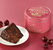 Sliced Buckingham Cherry Fruit Cake showing real cherries
