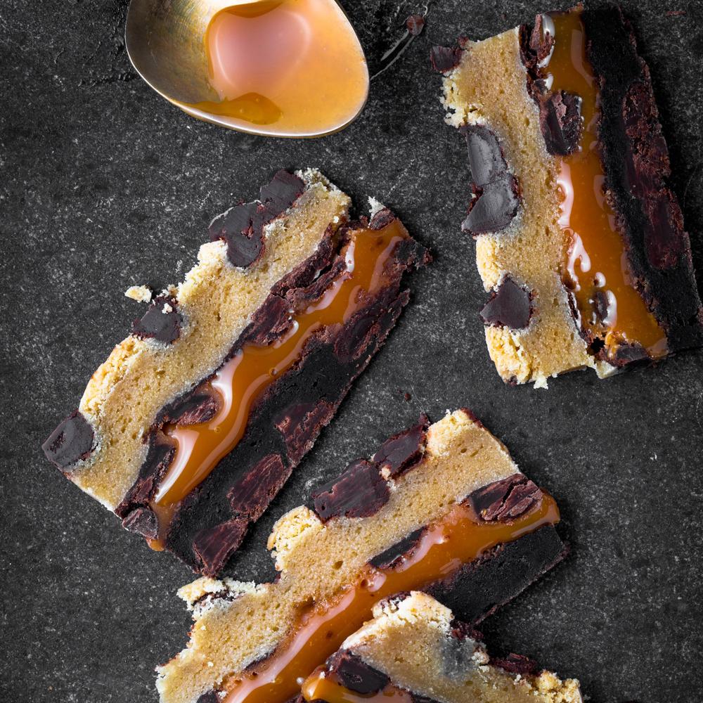 Killer Brownie cookie dough brownies - layers of chocolate chip cookies caramel and brownies