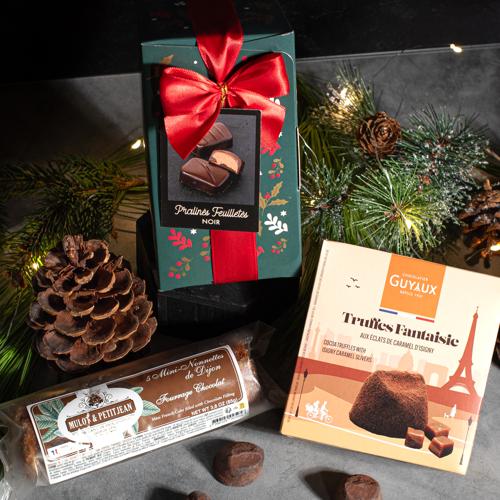 Luxury European Christmas gift box with imported chocolates set on a holiday table