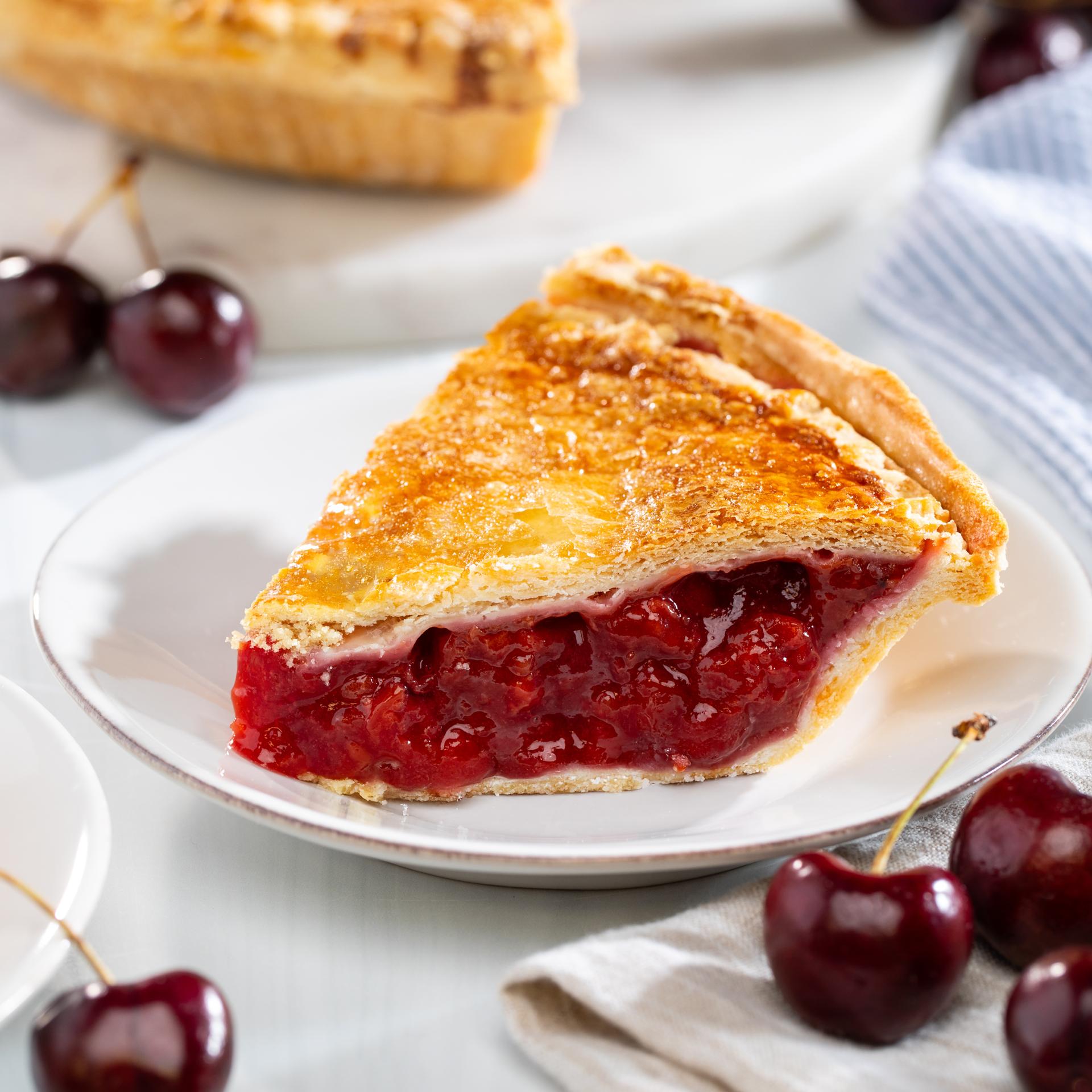 A Slice of Sweet and Tart Cherry Pie with Flaky Buttery Crust