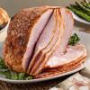 DLM spiral sliced honey glazed Heavenly Ham  on a serving plate on a table for the holidays