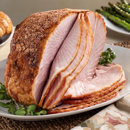 DLM spiral sliced honey glazed Heavenly Ham  on a serving plate on a table for the holidays