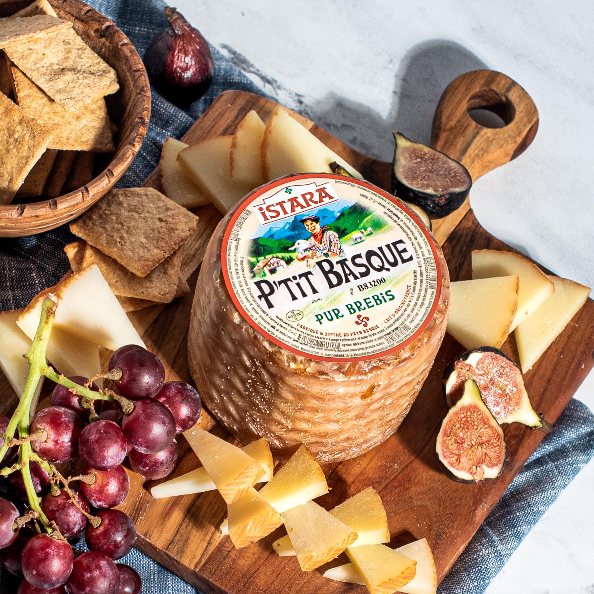 Istara P'tit Basque Sheep's Cheese Sliced P'tit Basque sheep's milk cheese showing creamy interior  Wheel