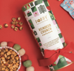 Poppy Reindeer Crunch Popcorn Cylinder packaged for holiday gifting.