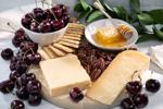 PRemium fruit and cherry gift box with cheese and crackers and honey