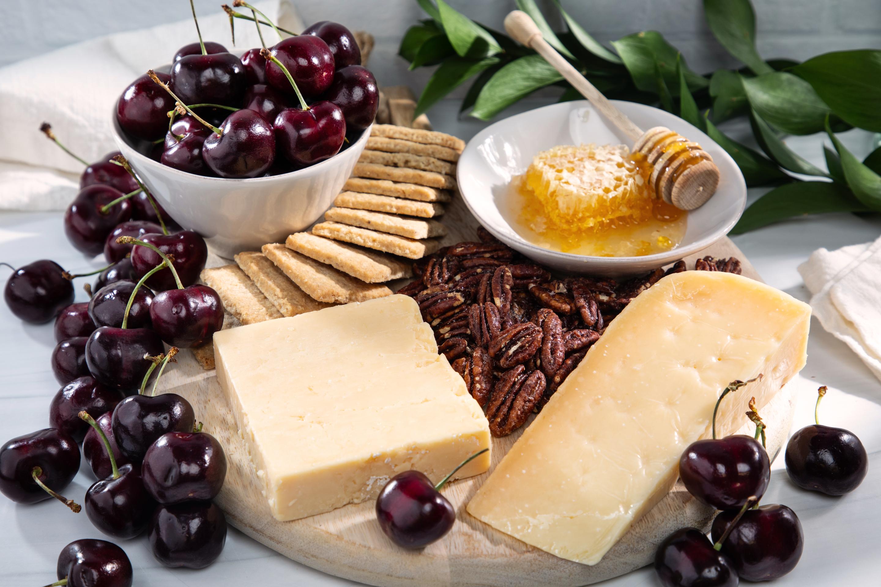 PRemium fruit and cherry gift box with cheese and crackers and honey