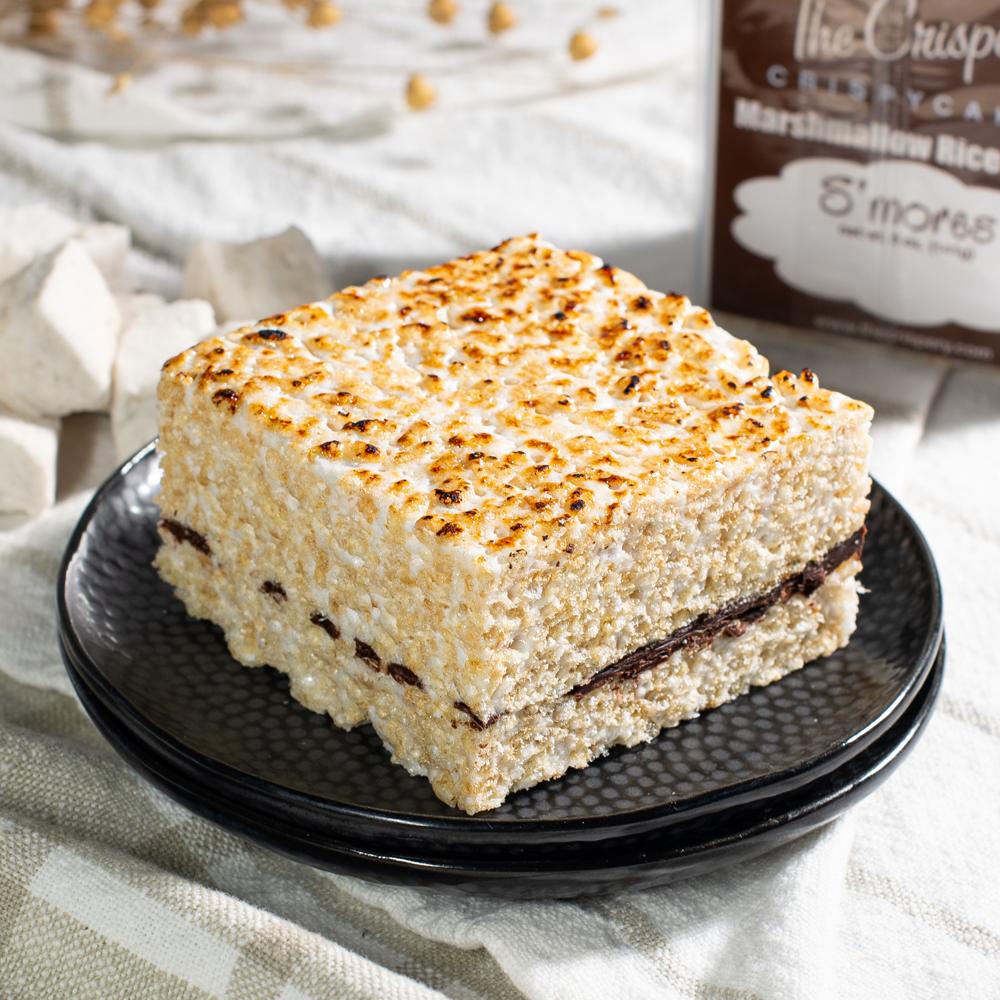 The Crispery marshmallow rice treat S'mores with a browned top and layer of chocolate fudge