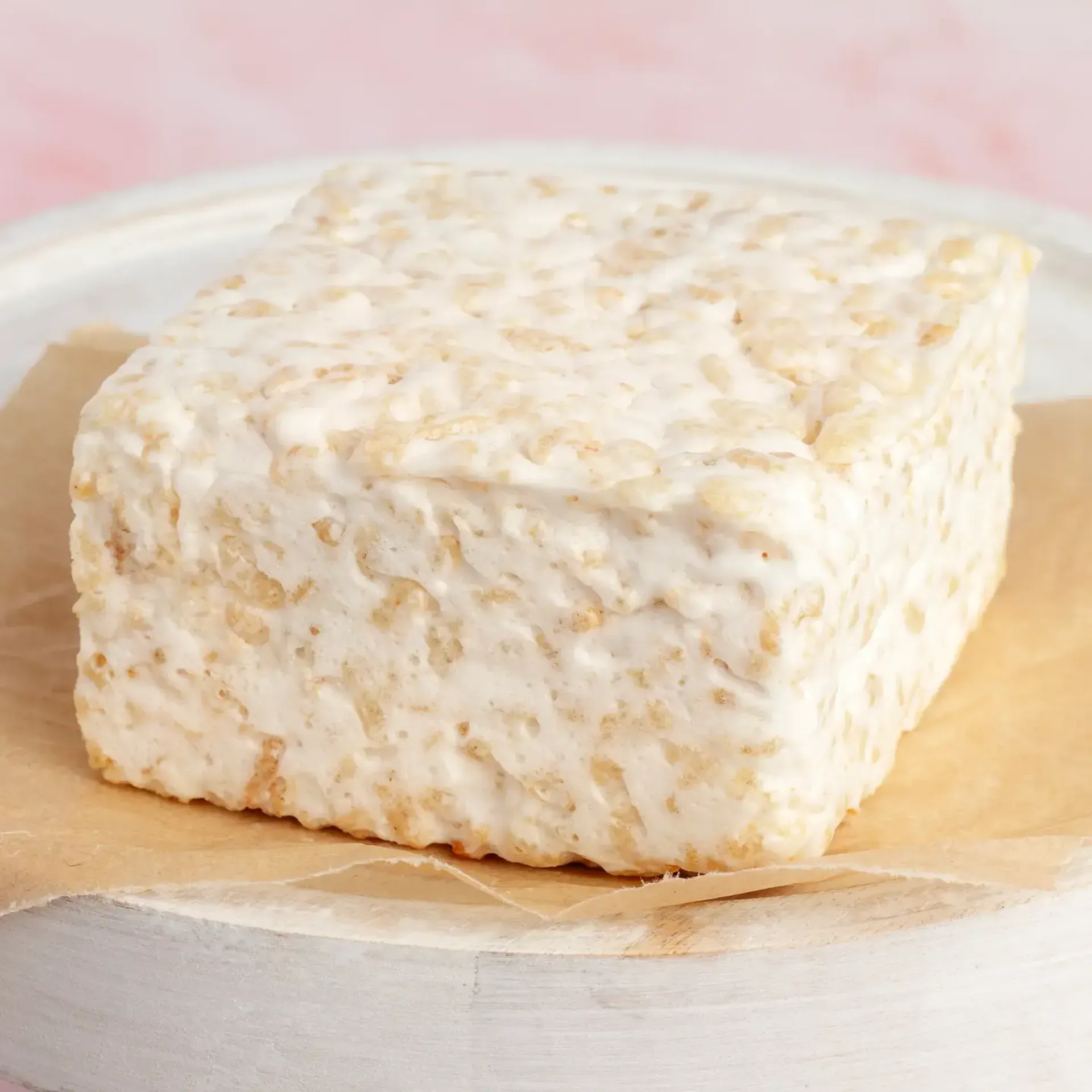 The Crispery Plain and Sweet gourmet marshmallow rice crispy cake individually wrapped on a light background.