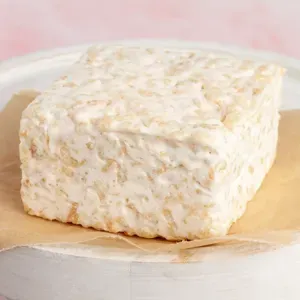 The Crispery Plain and Sweet gourmet marshmallow rice crispy cake individually wrapped on a light background.