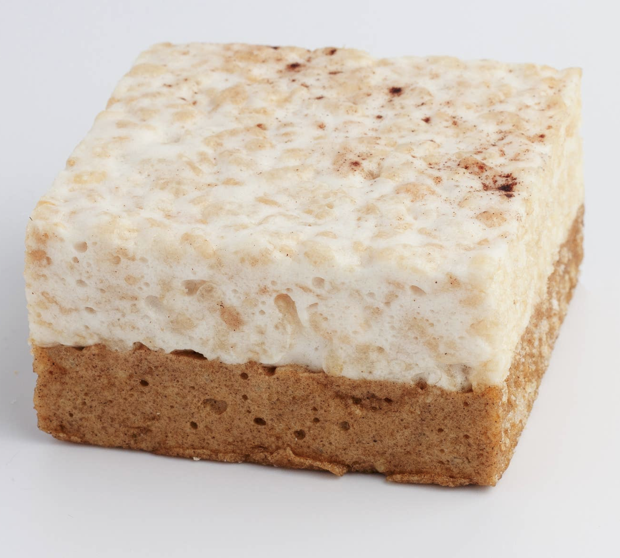The Cripsery Pumpkin SPice Crispy cake up close showing graham cracker spiced cake with a crispy marshmallow cake on top