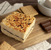 Crispery s'mores on a board with Hershey's Chocolate and graham crackers