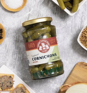 Jar of Three Little Pigs Cornichons – French baby gherkins pickled in vinegar and spices